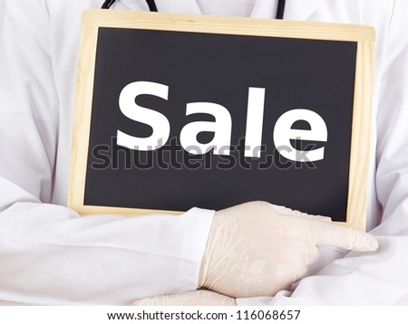 Doctor shows information on blackboard: sale