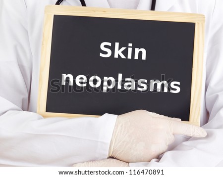 Doctor shows information on blackboard: skin neoplasms
