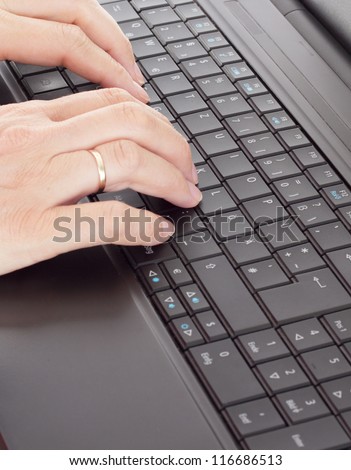 Person typing on the computer