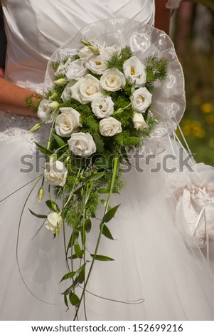 wedding scene with bride dress and bouquet