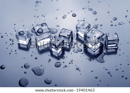 Ice cubes and water drops  on a reflective surface. square crystal