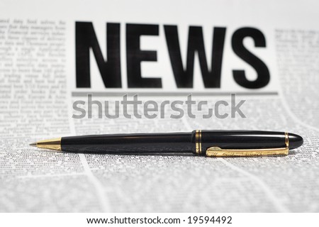 luxury pen on newspaper page