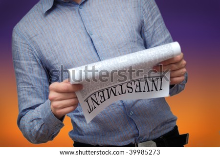 investment news on newspaper page. financial business concept image of a newspaper headline