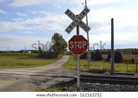 Railroad Tracks crossing a dusty dirt road in rural Michigan, USA