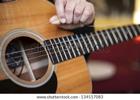 a broken string on an acoustic guitar