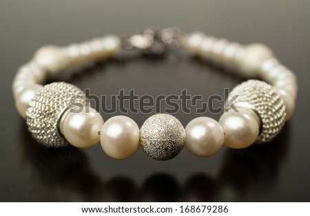 Pearl bracelet isolated on black