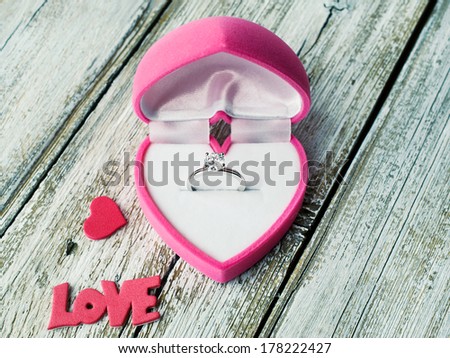 Ring with diamond in heart shaped box close-up