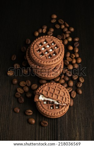 cocoa cookies with coffee beans on a dark background