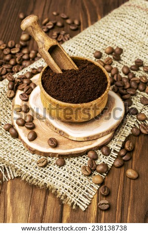 Ground coffee in a wooden bowl. Rustic style