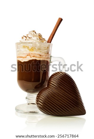 Hot chocolate in a glass and chocolate heart isolated on white