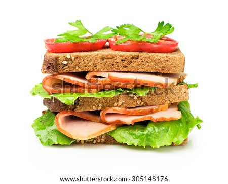 Sandwich with a ham and tomatoes isolated over white