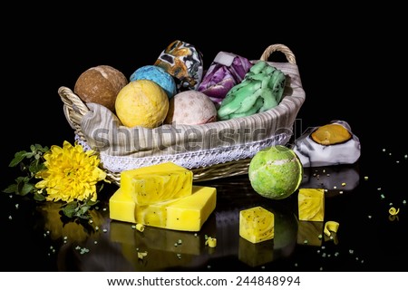 Spa. Stylish still life with a set of handmade soap on a black background.