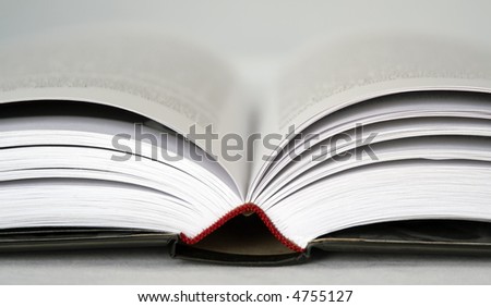 Black book extremly close on a white background