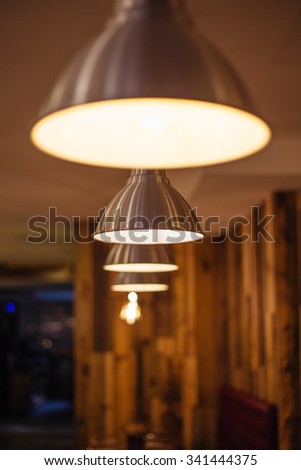 Interior with big lamp on ceiling at mood ambient