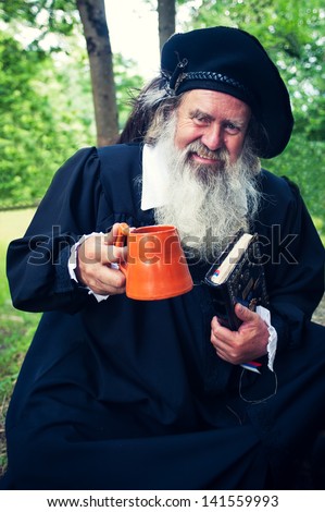 BLED, SLOVENIA - JUNE 9: Unidentified man dressed as medieval writer on June 9, 2013 on Castle Bled. The person this man represents is Primoz Trubar writer of the first Slovenian book in 16th century.