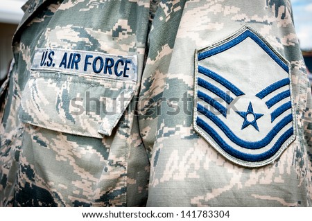 Detail of United states air force soldier\'s uniform with emblem in focus.