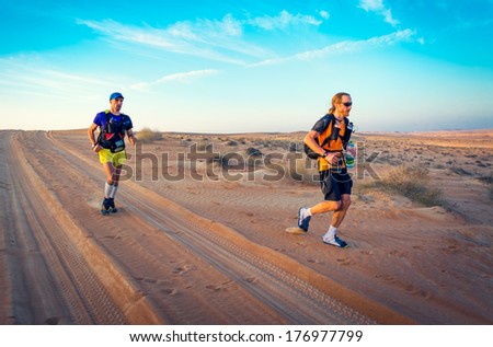 Wahiba Desert, Oman - January 29: Winners Of Extreme Endurance Marathon Transomania 2014, Joao Oliveira And Johan Steene, Evening Before Arriving To The Finish Point, On January 29, 2014.