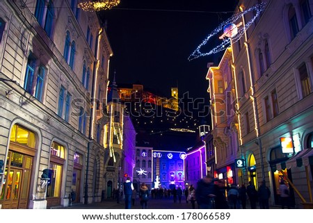LJUBLJANA, SLOVENIA - DECEMBER 30: Ljubljana castle and street in festive lightning for Christmas and New Year\'s eve celebration with entertainment program. Ljubljana, Slovenia, on December 30, 2013