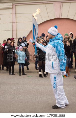 TVER, RUSSIA - MARCH 2, 2014: Torchbearer with a torch on the Paralympic Torch Relay