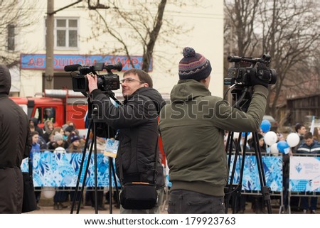 TVER, RUSSIA - MARCH 2, 2014: Journalists at the Paralympic Torch Relay in Tver. Relay runs from 26 February to 7 March