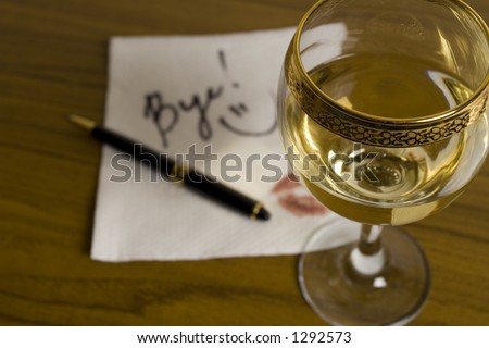 Glass of wine and out of focus word \