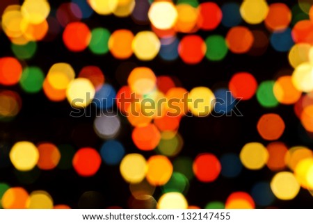 Multicolored Christmas tree lights bokeh and sparkles