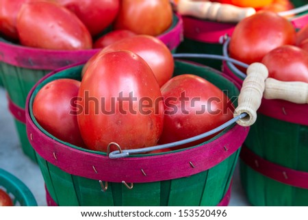 Organically grown red roma tomatoes on display at local farmer market