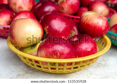 Locally grown red apples on display for sale at local farmers market