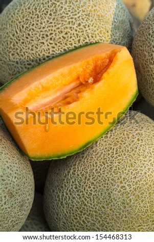 Fresh locally grown display of cantaloupe melons for sale at local farmers market