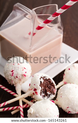Peppermint brownie cake pops and glass milk carton filled with chocolate milk and colorful straw