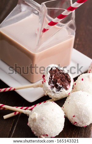 Peppermint brownie cake pops and glass milk carton filled with chocolate milk and colorful straw