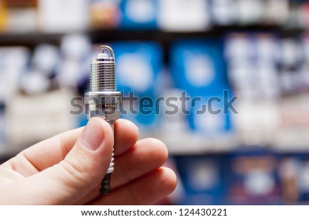 Spark plug in the hand