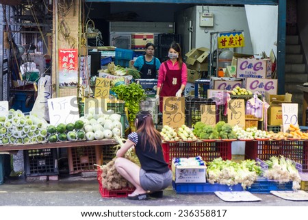 NEW TAIPEI CITY, TAIPEI, TAIWAN. NOVEMBER 2, 2014. Traditional street market in Taiwan with vendors selling street food.