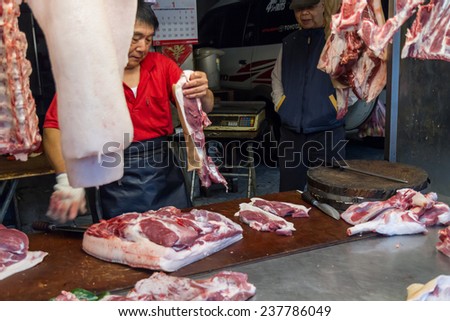 NEW TAIPEI CITY, TAIPEI, TAIWAN. NOVEMBER 2, 2014. Traditional street market in Taiwan with vendors selling fresh meat