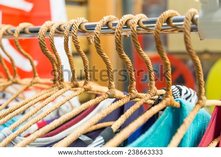 Clothing on hangers at a store in a night market