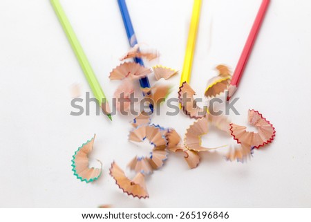 Pencil shavings falling with motion blur by pencil crayons