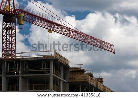 Construction site including concrete structure and crane