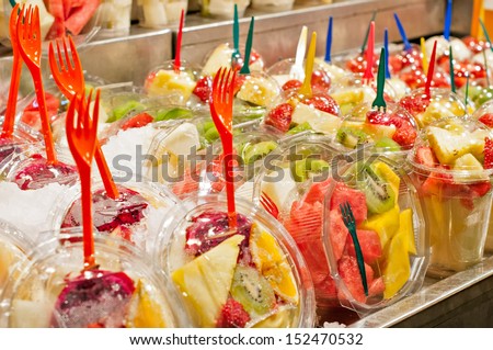 Assorted cut fruits in a market