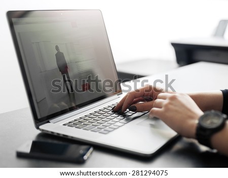 Shot of a young lady working with laptop, woman\'s hands on notebook computer, business person at  workplace using technology, flare light