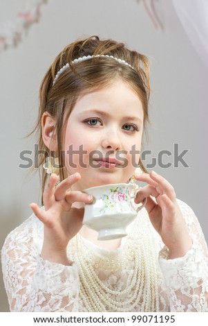 Girl Having Tea