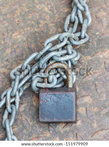 Black lock chain fastens metal industrial box