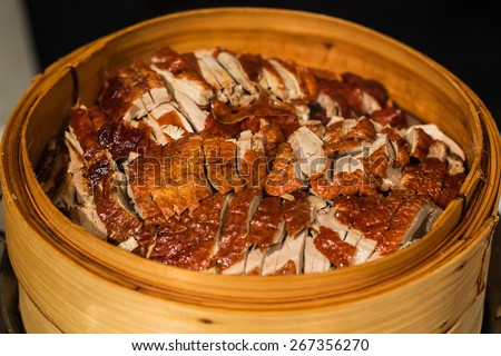 roasted duck in bamboo steamer, Chinese style