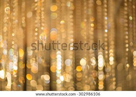 Blur Golden bokeh from beautiful crystal.