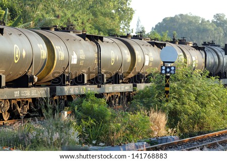 Railroad train of tanker cars transporting crude oil.