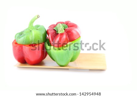 Bell pepper to Sliced in bamboo dish on white background.