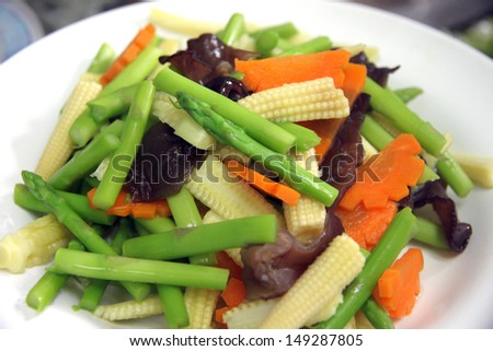 Closeup Many types of sliced vegetables in dish.