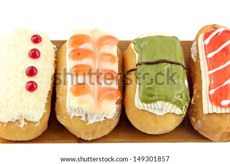 Donuts sort in the  bamboo dish on white background.