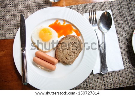 The picture Sausage egg bread in white dish.
