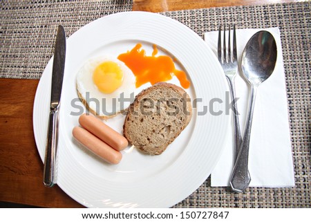 The picture Sausage egg bread in white dish.