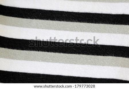 White alternating black T-Shirt of textured for background.